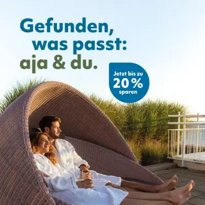 aja & du Ein Mann und eine Frau sitzen in einem Stuhl.