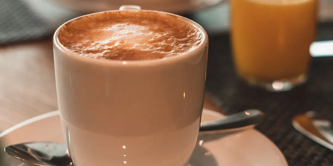 A cup of coffee on a saucer.